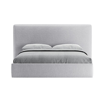 A luxurious bed with a plush headboard and a compact frame.
